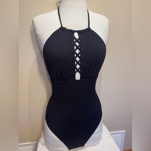Black one piece halter style textured swimsuit. NWT